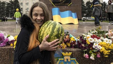 Woman holding watermelon