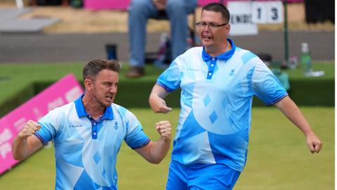 Garry Brown and Kevin Wallace celebrate winning gold for Scotland