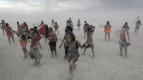 Burning Man ttendees wearing goggles