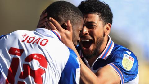 Lucas Joao and Josh Laurent celebrate a goal against Derby