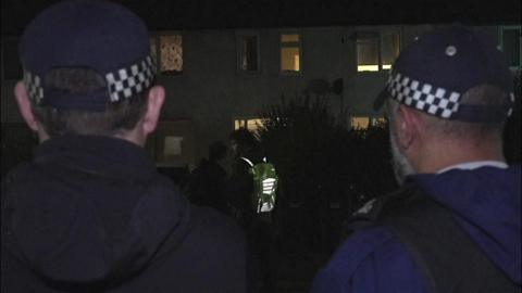 Met Police officers on a county lines raid