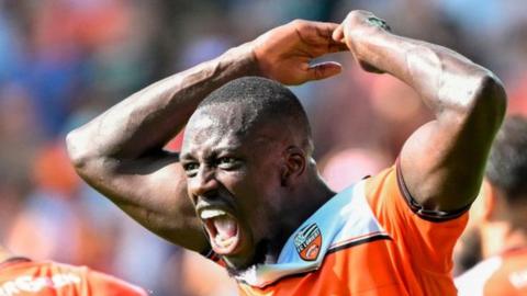 Benjamin Mendy celebrates after Romain Faivre's goal for Lorient against Monaco