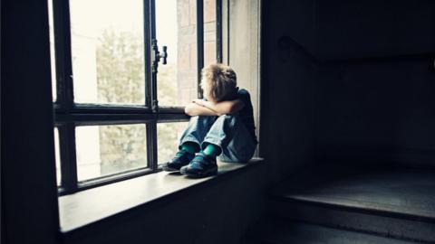 Boy at window