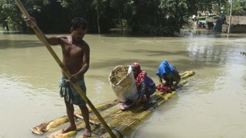 Floods displaced people using banana trees as rafts in Assam state in northeast India