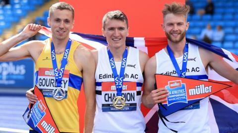 Silver Medallist Neil Gourley of Giffnock North, Gold Medallist Jake Wightman of Edinburgh and Bronze Medallist Josh Kerr of Edinburgh pose for a photo following the Men's 1500 Metres Final during Day Two of the Muller UK Athletics Championships at Manchester Regional Arena