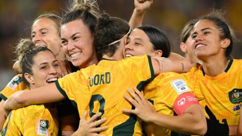 Australia celebrate winning on penalties against France
