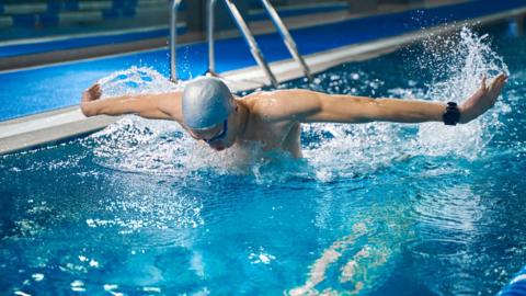 Swimmer in pool (stock image)