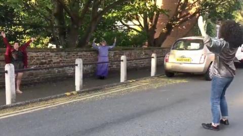 Residents dancing in the street