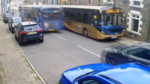 A bus mounting a pavement