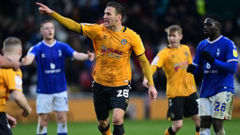 Mickey Demetriou celebrates his late goal