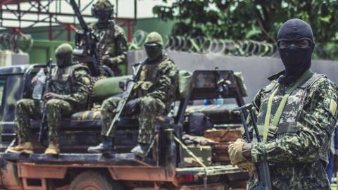 Special forces secure a road near Guinea's presidential palace on Monday