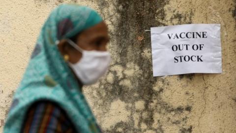 A notice about the shortage of coronavirus disease (COVID-19) vaccine supplies is seen at a vaccination centre, in Mumbai, India, April 8, 2021.