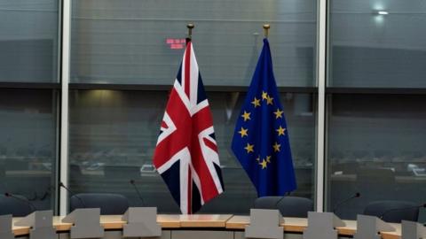 A British and an EU flag at the EU Commission HQ in Brussels