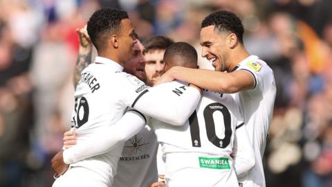 Swansea players celebrate