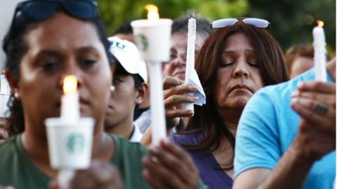 People attend a vigil for victims of the mass shooting at the Gilroy Garlic Festival on July 29, 2019