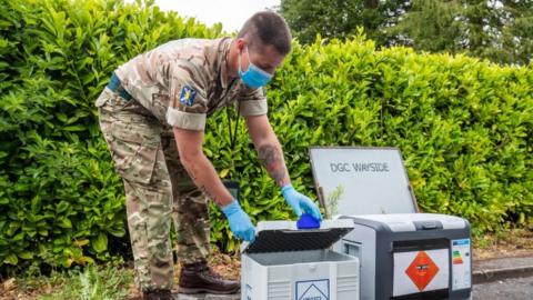 Soldier at mobile testing unit