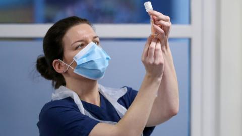 Vaccine held by nurse