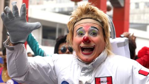 Clown takes part in a parade during Peru's Clown Day celebrations in Lima, Peru May 25, 2018