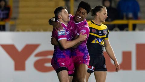 Try scorer Adam Clune (l) is congratulated by Kevin Naiqama