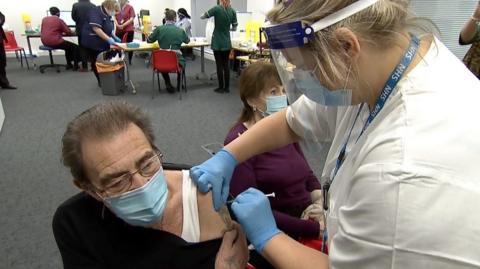 Man receiving vaccine