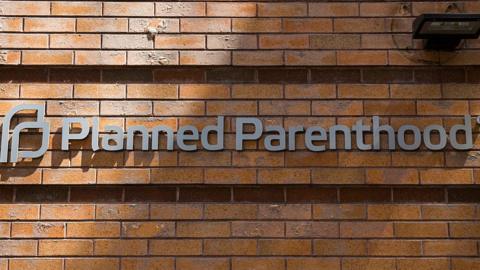 This image shows a Planned Parenthood sign on the exterior of a building.