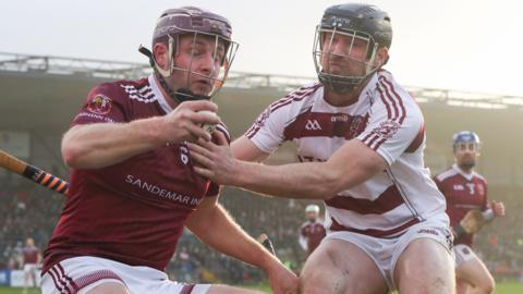 Cushendall's Eoghan Campbell is challenged by Slaughtneil's Gerald Bradley