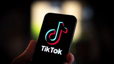 The TikTok logo is seen on a mobile device in this photo illustration in Warsaw, Poland on 20 July, 2023