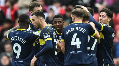 Middlesbrough players congratulate Isaiah Jones