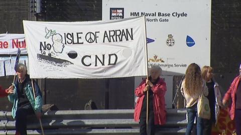 Demonstrators gathered at the gates to the base