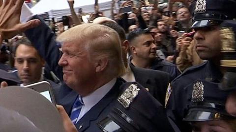 Donald Trump appears outside Trump Tower on 8 October 2016