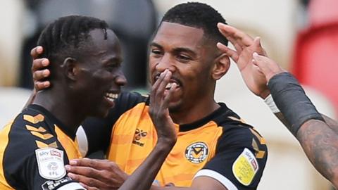 Saikou Janneh celebrates with his Newport team-mates