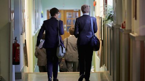 Schoolboys make their way to class at Altrincham Grammar School for Boys on September 8, 2016 in Altrincham, England.