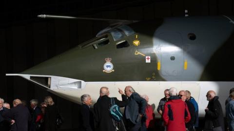 Cold War veterans, many of whom operated or worked on this very aircraft, admire the Handley Page Victor XH648 aircraft, which is on show at IWM Duxford, Cambridgeshire, following the completion of a five year restoration project