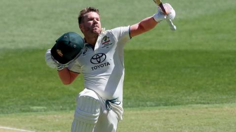 David Warner (left) celebrates with Steve Smith (right) after reaching 100 during the first Test against Pakistan in Perth