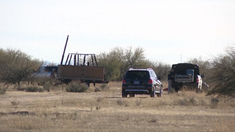 Scene showing investigators at the site of the crash
