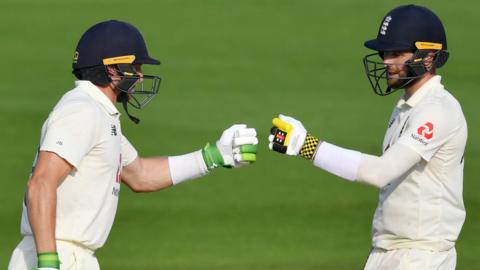 England's Jos Buttler and Chris Woakes