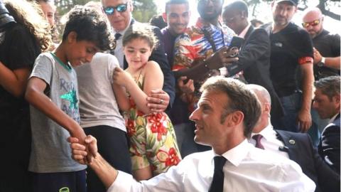 French President Emmanuel Macron visits the Benza district in Marseille, France, 28 June 2023