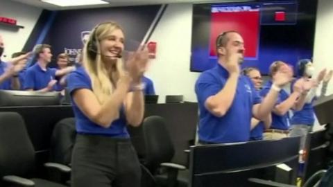 Nasa engineers clapping and celebrating