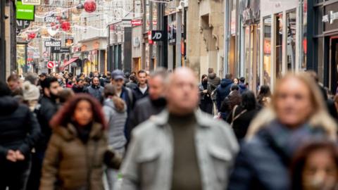 Shoppers in the Hague on 12 December 2020