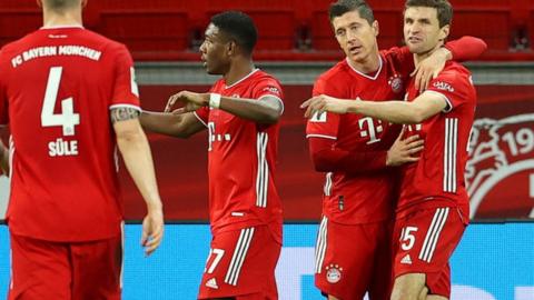 Robert Lewandowski celebrates with Bayern teammates