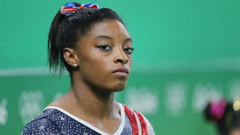 Simone Biles with a determined expression at the 2016 Rio Olympics