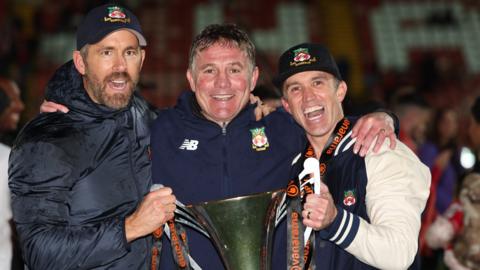 Wrexham owners Ryan Reynolds and Rob McElhenney with club manager Phil Parkinson (centre)