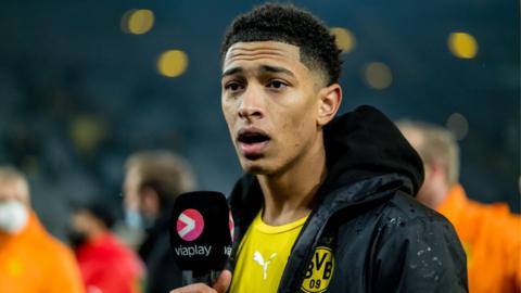 Borussia Dortmund midfielder Jude Bellingham speaks to the media after defeat by Bayern Munich