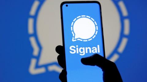 The Signal messaging app logo is seen on a smartphone