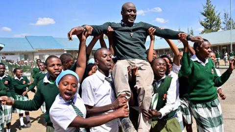 Peter Tabichi being held aloft