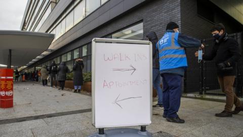 A person queuing at the Covid-19 vaccination centre at the Ulster Hospital in Belfast