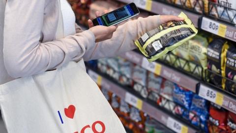 Shopper at experimental Tesco store