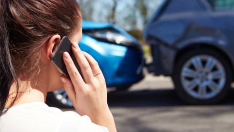 woman telephones after accident