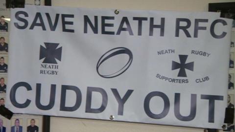 A banner reading "Save Neath RFC, Cuddy Out"