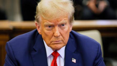 Former U.S. President Donald Trump sits in the courtroom during his civil fraud trial at New York Supreme Court on January 11, 2024 in New York City.